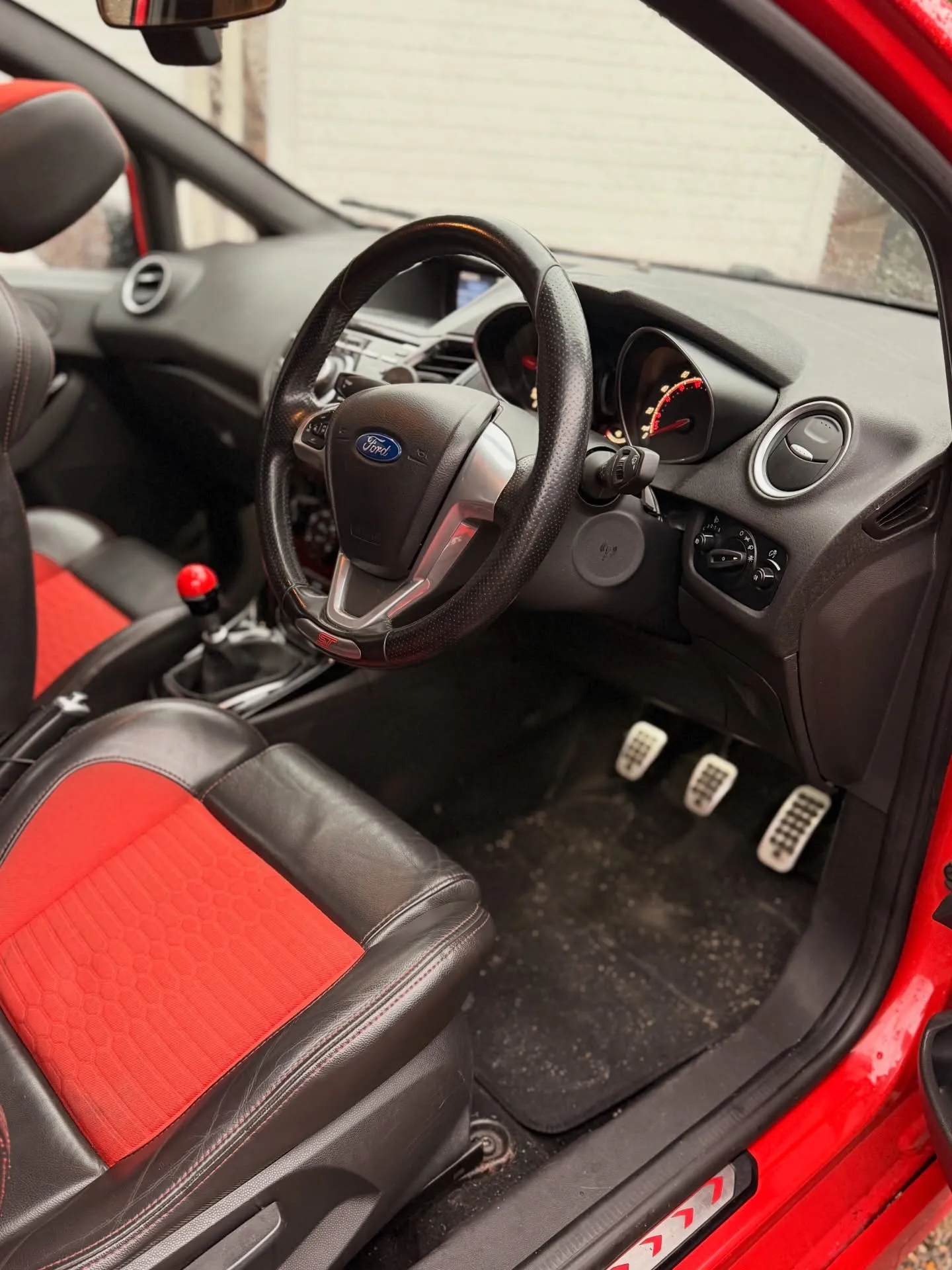 Ford Fiesta ST interior after a deep clean, red and black seats