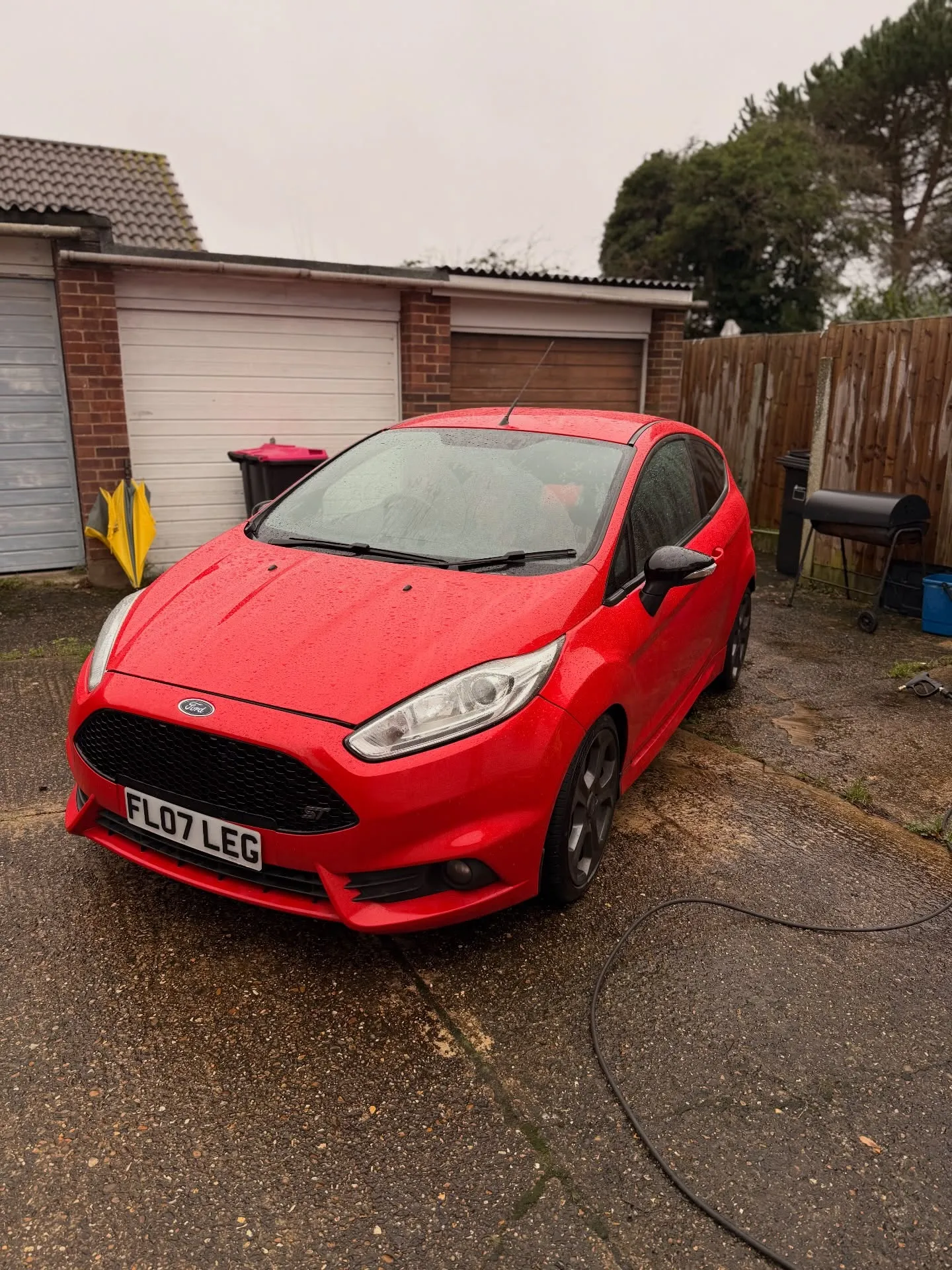 Red Ford Fiesta ST after an exterior wash