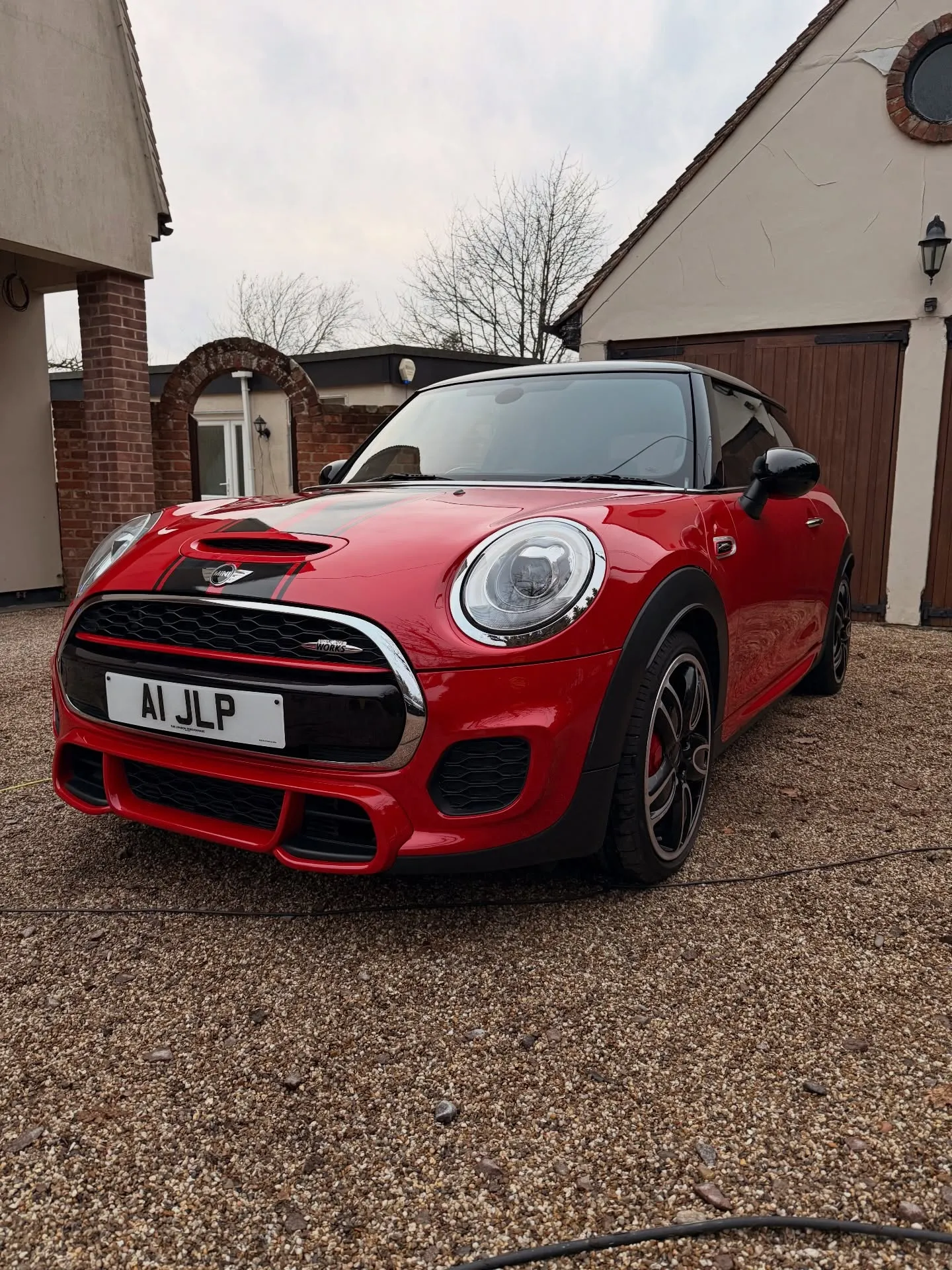 Front of a red Mini Cooper after a valet